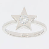 Star-shaped sterling silver ring featuring a round Moissanite gemstone, perfect for unique and elegant style.